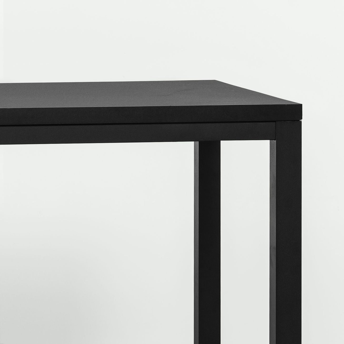 modern black office desk with minimalist metal legs against white background