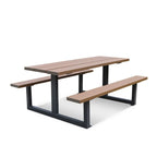 A modern outdoor picnic table with two attached benches, featuring brown composite-look slatted seats and backrests supported by a black metal frame, shown on a plain white background.