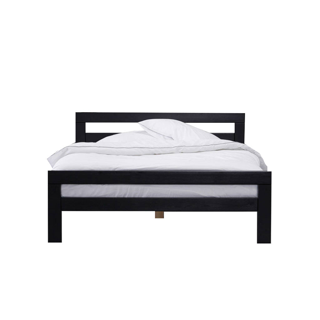 Black wooden bed frame with white bedding on a plain background