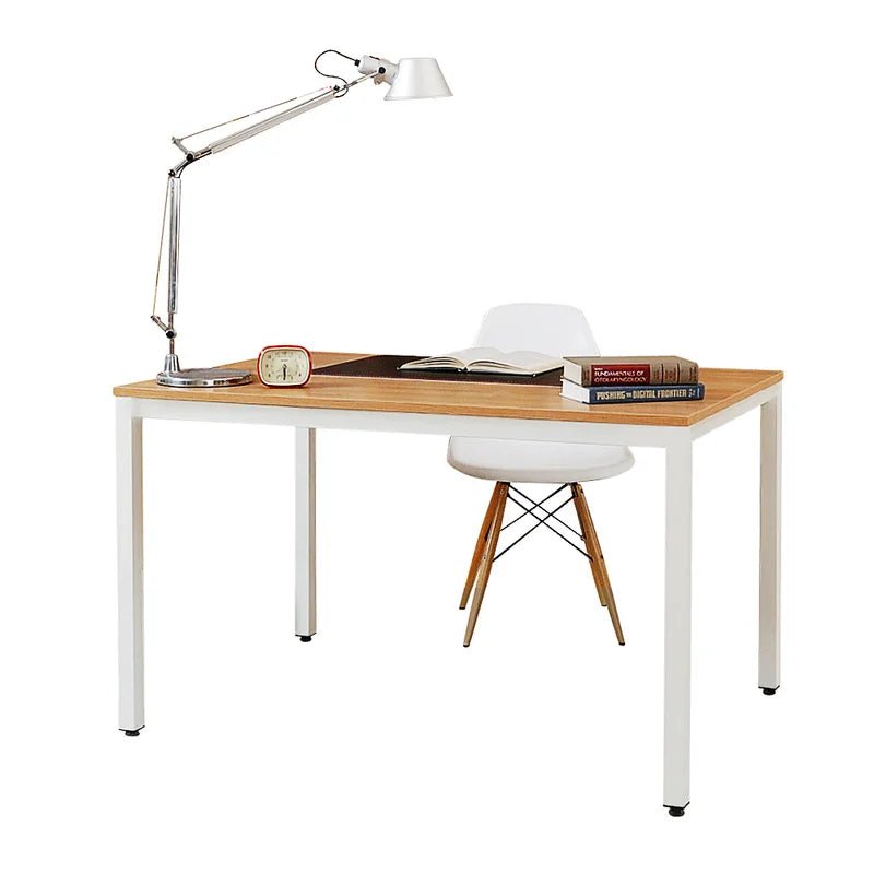 Modern minimalist desk with white metal legs, wood top, lamp, chair, books, and clock