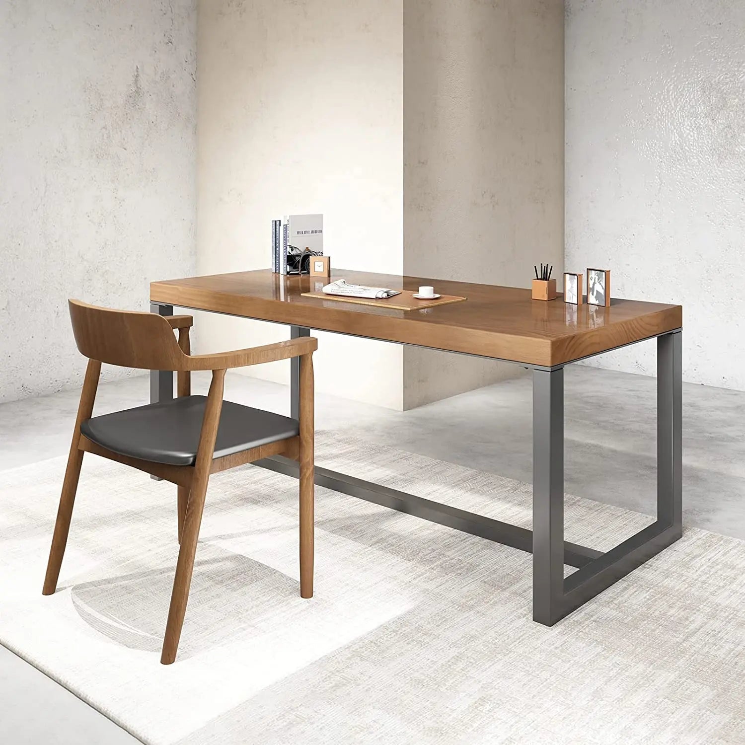 Modern black and brown office desk with metal frame and wooden chair in a minimalist room