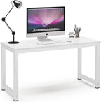Modern white desk with metal legs, computer, lamp, and office accessories