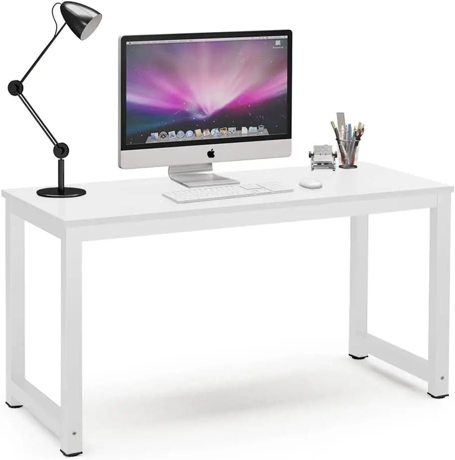 Modern white desk with metal legs, computer, lamp, and office accessories