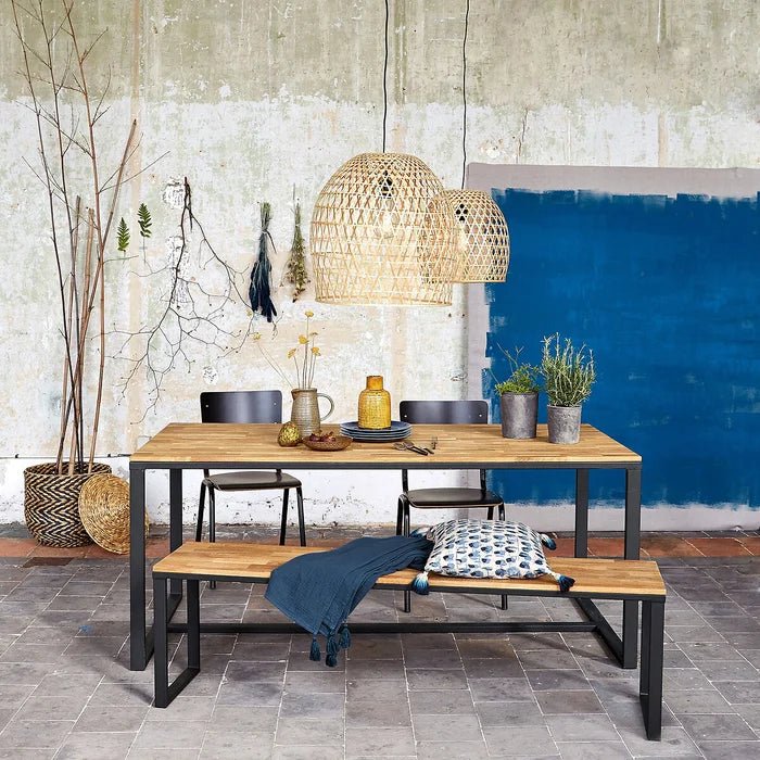 Solid oak bench and dining table set with metal frames in modern rustic dining area