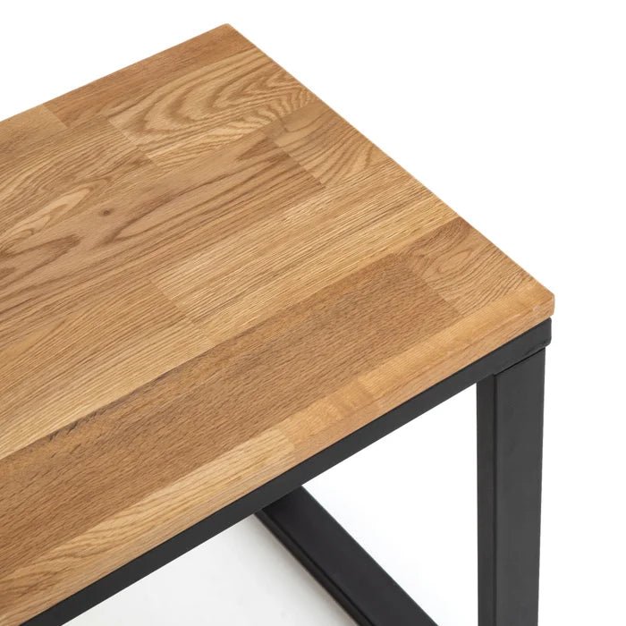 Solid oak bench with natural wood grain and black metal legs, modern minimalist design