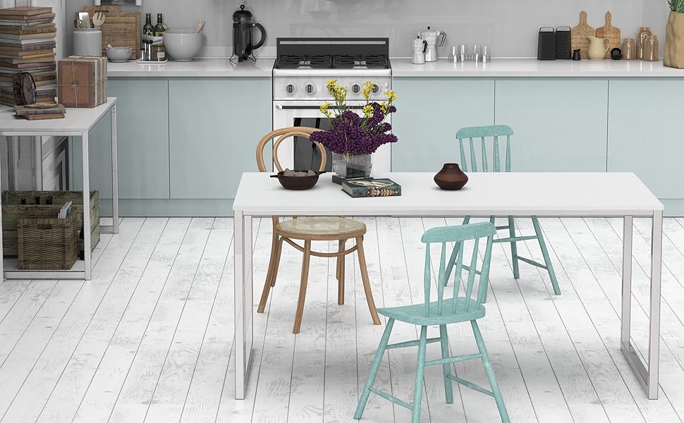 Modern white office desk with metal frame and assorted chairs in bright kitchen setting