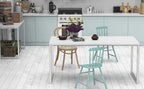 Modern white office desk with metal frame and assorted chairs in bright kitchen setting