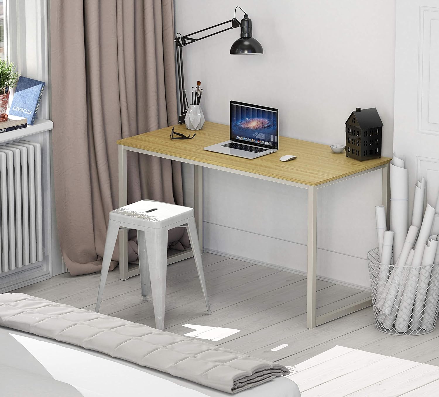 Modern office desk with light wood top and metal legs in a minimalist home workspace