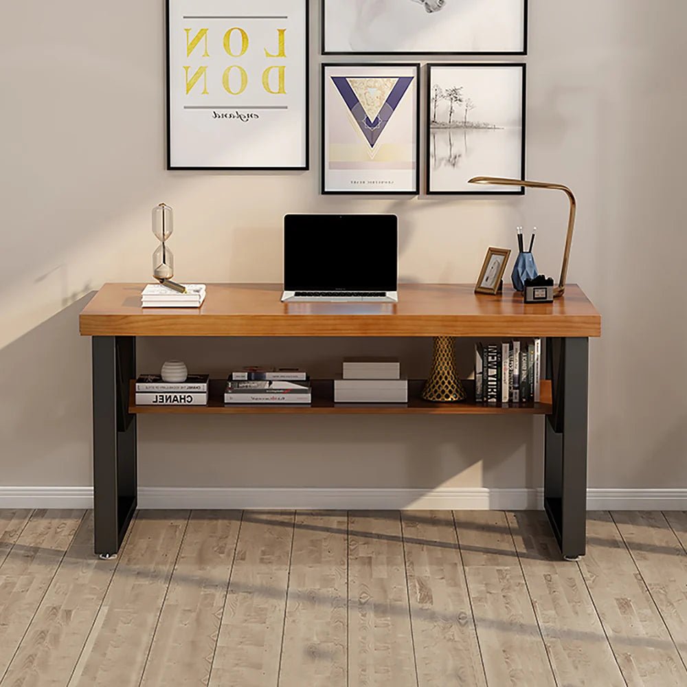 Modern double layer wooden computer desk with black legs, shelf, and office decor