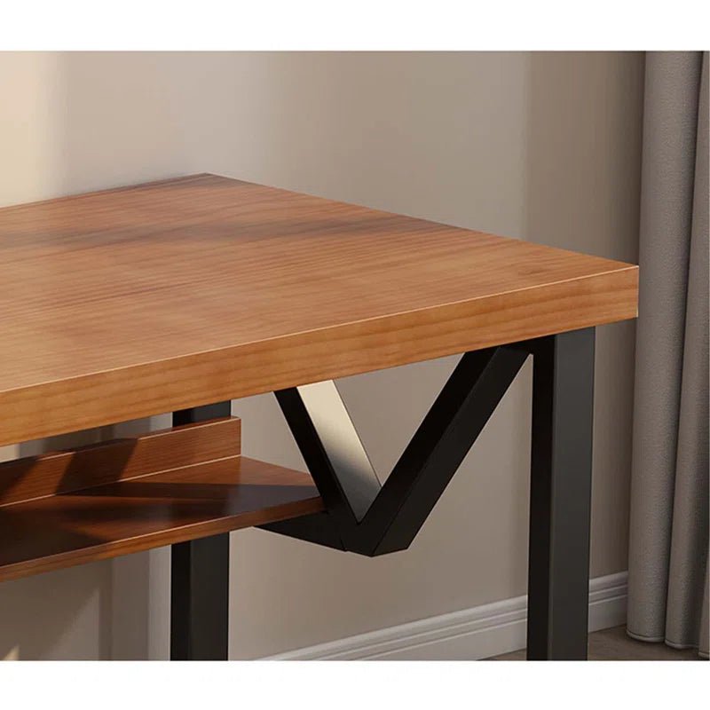 Modern double-layer computer desk with wood top and black metal frame in home setting
