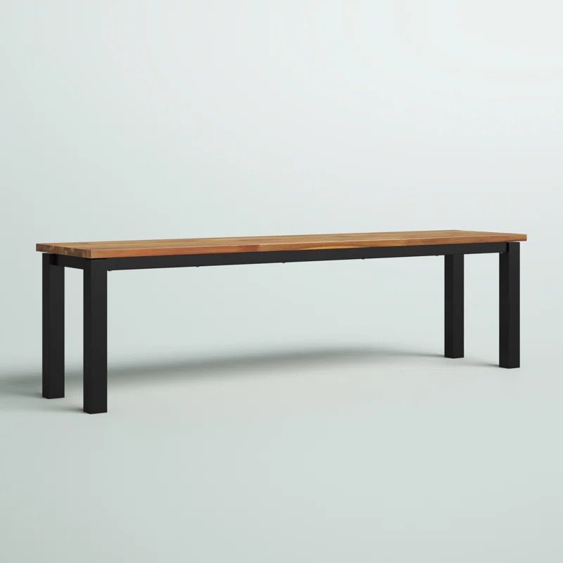 Modern metal and wood outdoor bench with black legs on a light background