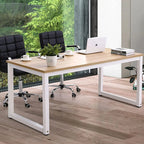 Modern office desk with wood top & white steel frame, paired with black rolling chairs in bright workspace