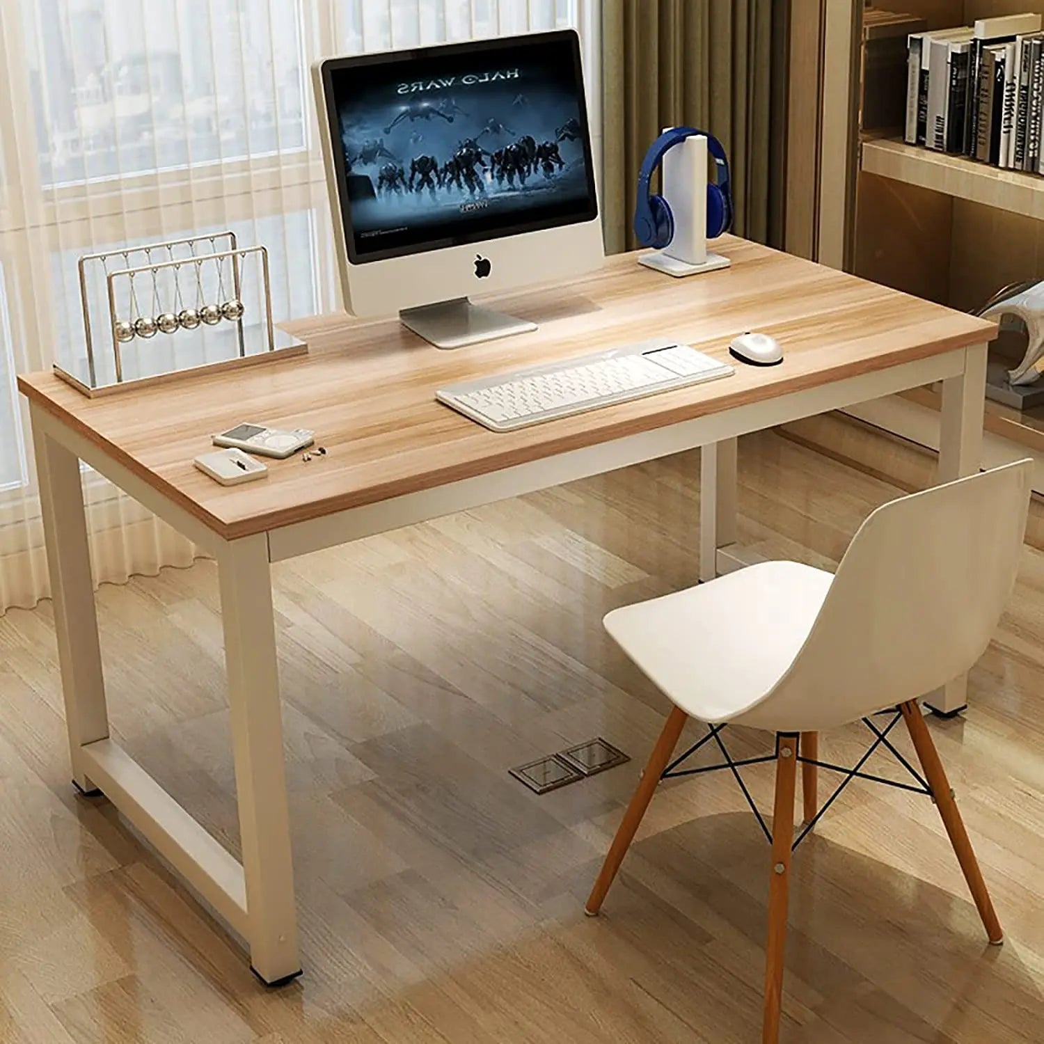 Modern wood-top office desk with steel legs, set with iMac, keyboard, and white chair in bright home office