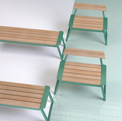 Modern public backless benches with wooden slats and green metal frames on tiled floor