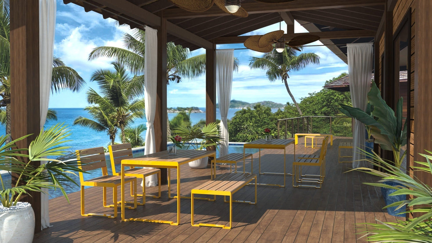 Modern outdoor patio with yellow-frame benches and tables, ocean view, and tropical plants