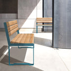 Modern 3-seater wooden bench with metal frame and backrest in a sunlit indoor setting