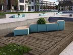 Modern outdoor aqua modular bench with built-in planters on a wooden patio in urban setting