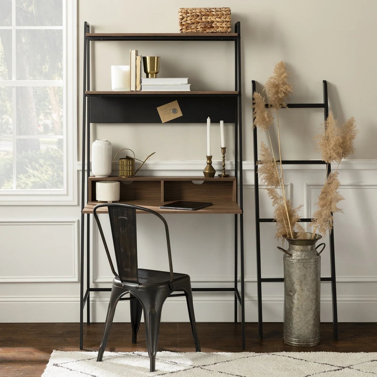 Modern ladder desk with shelves, black metal chair, and home office decor in bright room