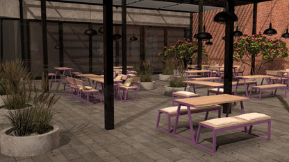 Outdoor patio with wooden tables, purple-framed benches, and potted plants