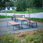 Outdoor modern wooden table with blue metal frame and matching benches, seating 4-6 people