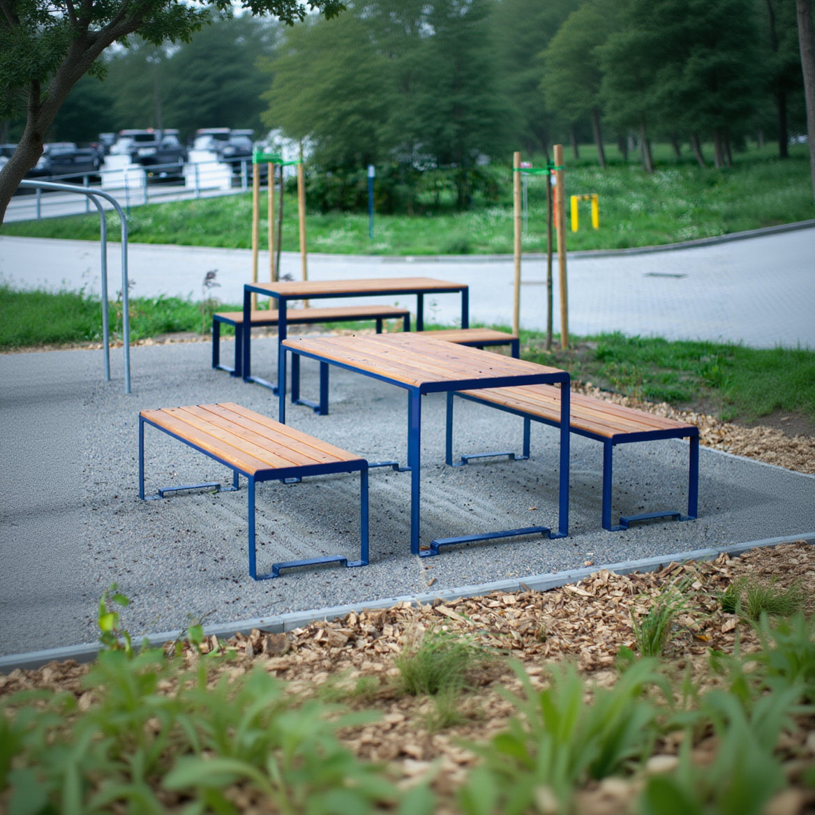Outdoor modern wooden table with blue metal frame and matching benches, seating 4-6 people
