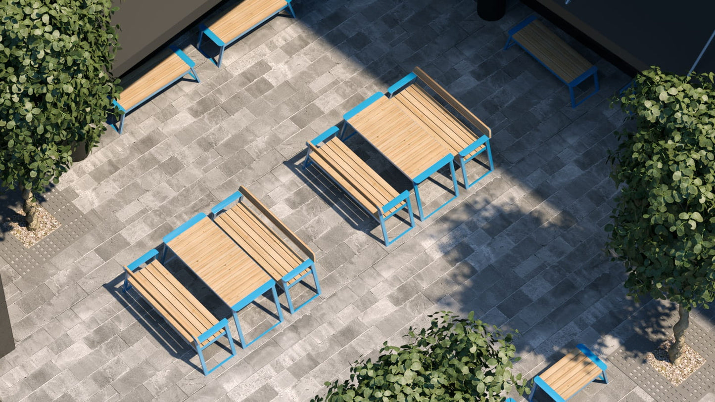Modern outdoor tables with matching benches, wood tops and blue frames on a stone patio