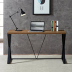 Modern black and brown steel desk with lamp, laptop, and books in home office setting