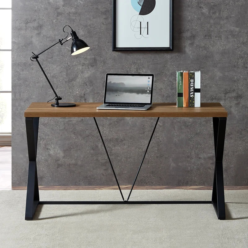Modern black and brown steel desk with lamp, laptop, and books in home office setting