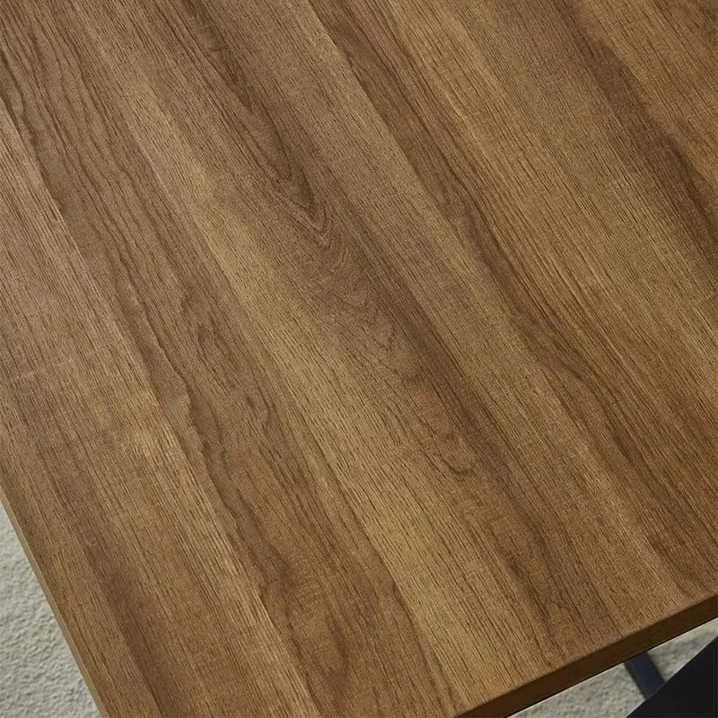 Close-up of brown wood grain desk surface with modern finish