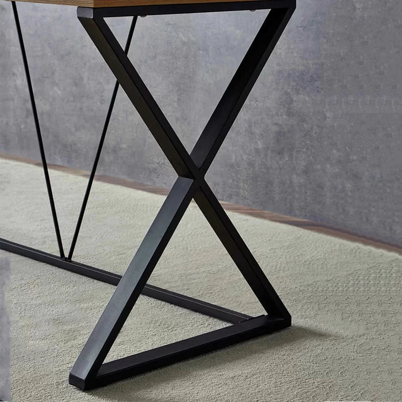 Modern black steel desk with X-frame base and brown tabletop on light carpet
