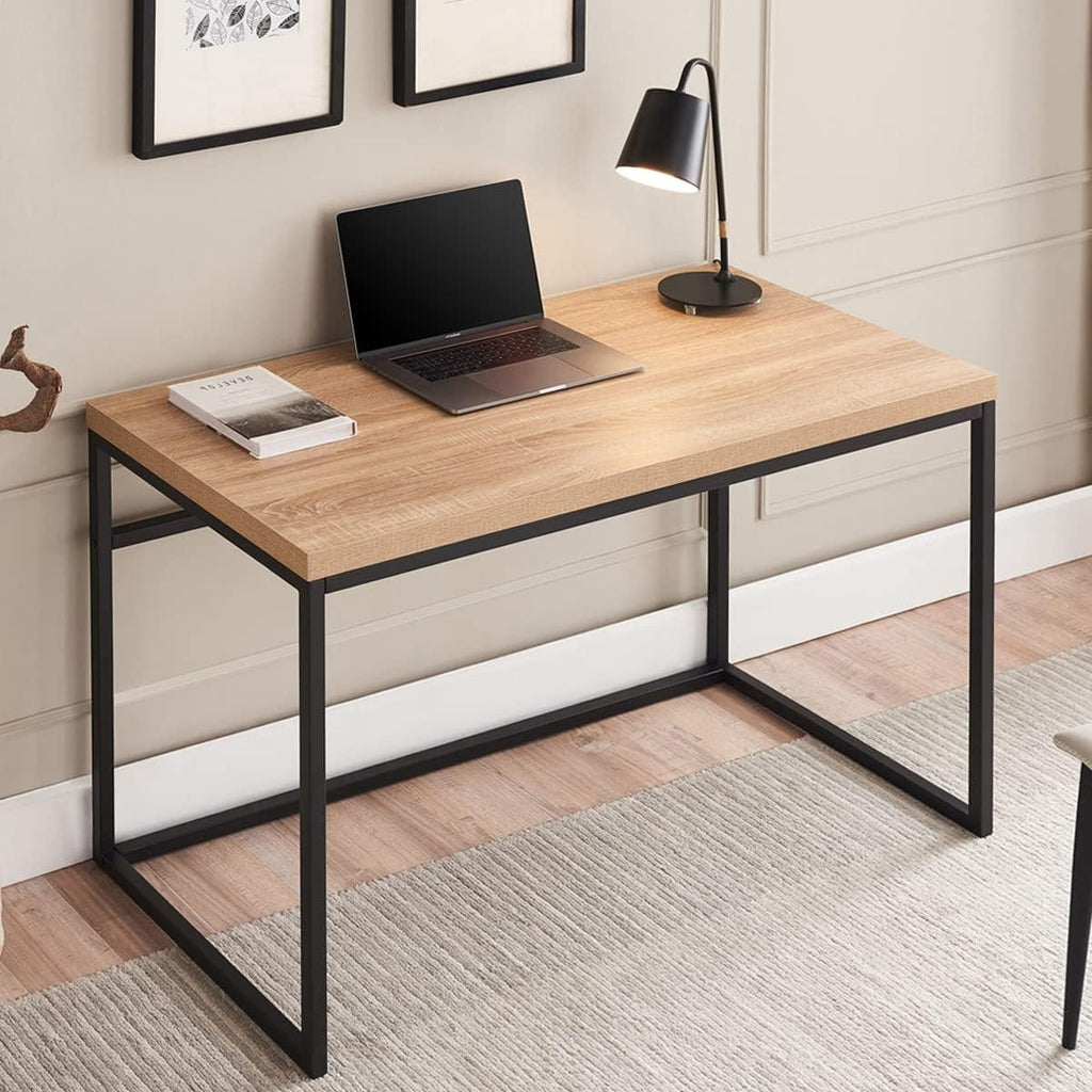 Modern wood and metal desk with laptop, lamp, and decor in a stylish home office setting