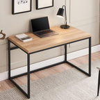 Modern wood and metal desk with laptop, lamp, and decor in a stylish home office setting